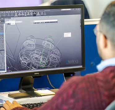 Engineer working in the conceptual design department of Sterling Thermal Technology, designing a heat exchanger