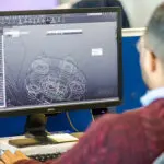 Engineer working in the conceptual design department of Sterling Thermal Technology, designing a heat exchanger